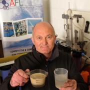 CLEAN WATER: Dave Franks at Aycliffe Filtration in Darlington with before examples of dirty water and after of clean water.        Picture: ANDY LAMB (13089881)