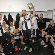 Spennymoor Town FC's captain Chris Mason celebrates with his team mates after becoming league champions last season
