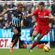 HAMSTRUNG: Newcastle United's Rolando Aarons tussles with Liverpool's Steven Gerrard		Picture: CHRIS BOOTH