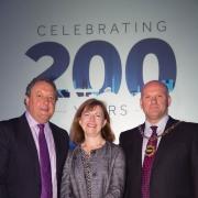 CHAIN OF OFFICE: Mike Matthews (right) and Dave Laws with NECC chairman Lucy Winskell.