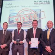 SUCCESS: Randall Orchard's Darragh Spencer, second left, pictured alongside Alan O’Neile, from the Construction Skills Certification Scheme, Graeme Newton, managing director of Randall Orchard, and former England rugby union player Brian Moore