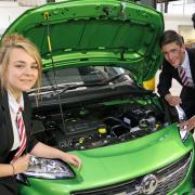 LEARNING: Darlington School of Mathematics and Science students get under the bonnet at Vauxhall dealer Sherwoods. Pictured are Rebecca Smith, Kristen Morrison, Nizam Uddin and Carl Younghusband