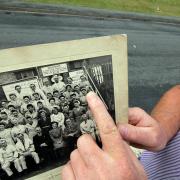 Angel delight: John Finley points to a picture he has unearthed that shows his grandmother with fellow Aycliffe Angels.