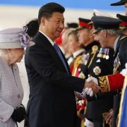 Queen Elizabeth II introduces Chinese President Xi Jinping (centre) to  dignitaries during the official welcome ceremony at Horseguards Parade in London, on the first official day of the Chinese state visit. Picture: Alastair Grant/PA Wire