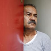 Iranian asylum seeker Mohammed Bagher Bayzavi at his front door in Union Street, Middlesbrough, which was painted red by Jomast,
