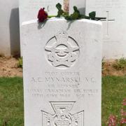 A  single red rose on Mynarski's headstone at the cemetery in Meharicourt, France
