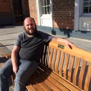 Richard Lee on the new bench in Dovecote Street
