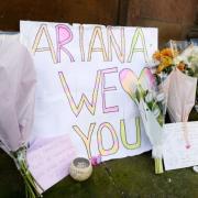 GRIEF: Flowers left at the scene of the Ariana Grande concert, in Manchester, where a bomber blew himself up. Picture: PA