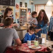 Stacey marches into the cafe to confront Whitney and Woody