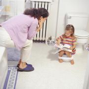 A mother potty training her daughter... but would you pay somone else to do the training?