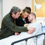 The family wait expectantly as first Aidan Connor (Shayne Ward) is wheeled down the operating theatre