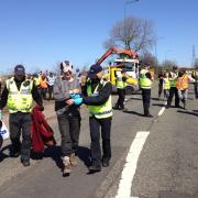 Police lead away a protester from the Pont Valley Protection Camp Picture: GAVIN ENGELBRECHT