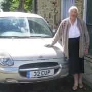 Dorothy Morton with her car - and number plate