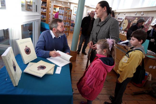 ROYAL FIND: Dr Steve Sherlock, who discovered the Saxon Princess jewellery at Loftus, a piece of which is shown below, signs copies of his book at Kirkleatham Museum