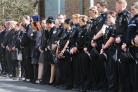 SILENT TRIBUTE: Officers line up outside Darlington police station as the funeral cortege passes