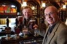 CHARITY SALES: The Reverend David Cleeves enjoys a pint of Theakston Masham Four and Twenty with T&R Theakston’s executive director Simon Theakston