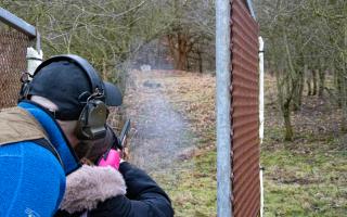 Phil Masters coaching junior member Olivia Hall, 12, as she hits a clay at Marne Clay Shooting Club. Picture: Chris Barron