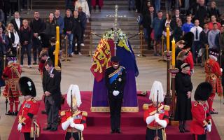 Queen's eight grandchildren hold vigil as Prince Harry wears military uniform