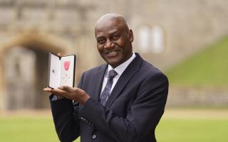 Gary Bennett, Patron of Show Racism The Red Card, after being made a MBE by King Charles III at Windsor Castle.