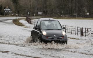 A car driving through floods in Masham in February 2020.