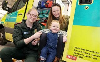 A North East family were left overjoyed after reuniting with the paramedic who helped them after a surprise delivery Credit: NEAS