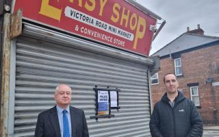 Picture attached of Shaun Trevor, of Darlington Trading Standards, and Detective Constable Jonathan Keenan, from Durham Constabulary, serving a closure notice to Easy Shop, on Victoria Road.