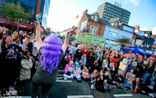 Penni T in front of crowd at Middlesbrough Pride.