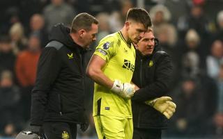 Nick Pope is helped off the field during December's win over Manchester United