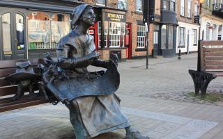 The sculpture of Old Mother Shipton in Knaresborough market place, who was said to have been born in a  nearby cave and became famous in her own lifetime for her many predictions
