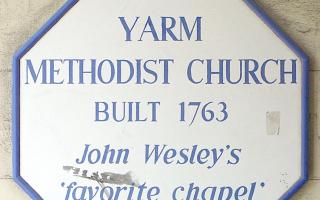 The sign pointing out the 1763 church
