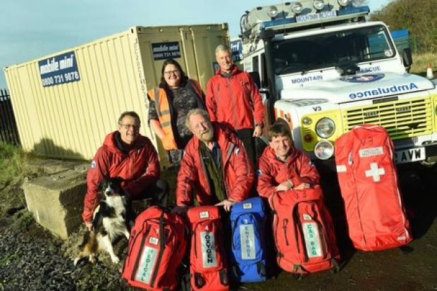 Mobile Mini have donated two containers to the Cleveland Mountain Rescue Team while their Great Ayton base is refurbished. Dawne McClelland was there to hand over the units to Ken Dunbar from the team with other members of the team Picture: Doug Moody Pho