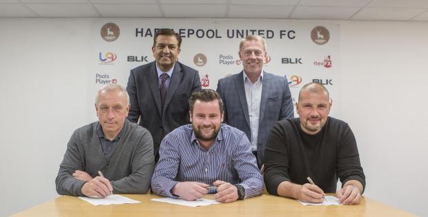 The Northern Echo: Matthew Bates with Ged McNamee, front left, and Ross Turnbull, front right. Chairman Raj Singh and director of football Craig Hignett are standing