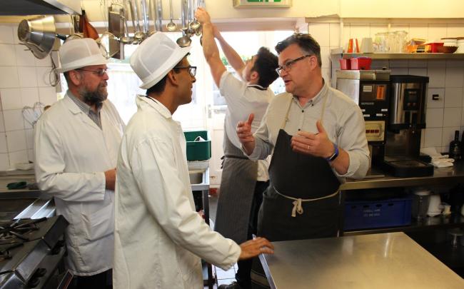 MP Rishi Sunak talks to chef patron Jonathan Harrison, right, in the kitchen of The Sandpiper, Leyburn, with Graham Bourne, Richmondshire District Council’s food safety technician