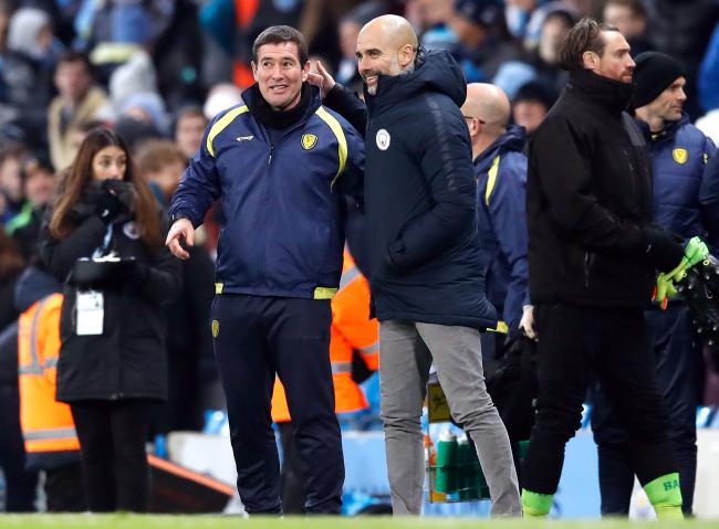 Burton Albion manager Nigel Clough (left) with Manchester City manager Pep Guardiola after City had won their Carabao Cup, semi final first leg 9-0